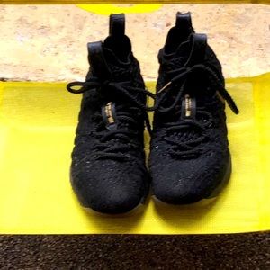 These are LeBron’s gold and Black basketball shoes